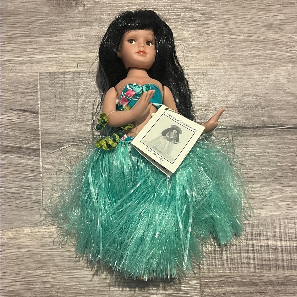 Porcelain Hula Doll with Black Hair and Teal Skirt